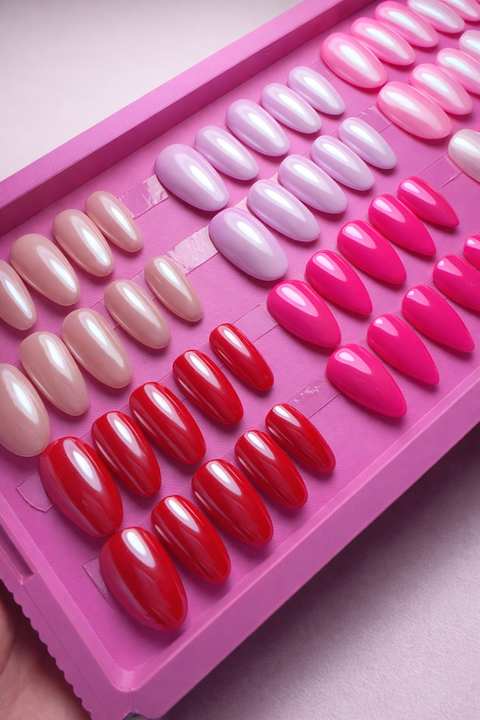 Set of 6 sets of press on nails. pink, red, and white gel polish with chrome and glossy top coat  in a pink case.