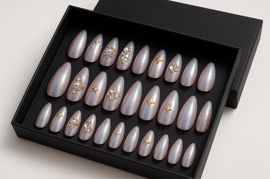 "Professional product photography of a set of 24 holographic press-on nails with rose gold and silver shimmer, 3D gems and pearl details, fairy tale inspired design, elegant almond shapes, arranged in luxury black packaging box, clean white background, enchanting beauty product styling, realistic nail texture"